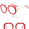 Red anti-blue light eyeglasses frame with gold accents shown in a studio setting