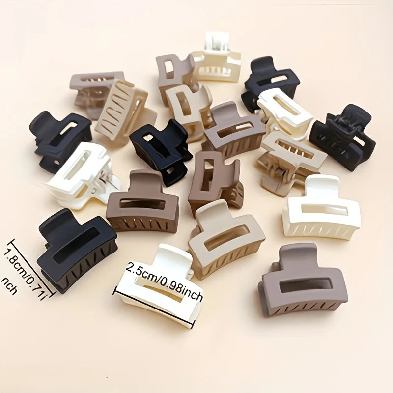 A collection of twelve rectangular hair clips in various shades of brown, black, and white.