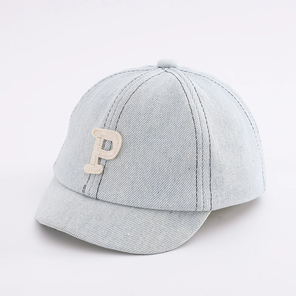 A light gray denim baseball cap with a tan embroidered initial P