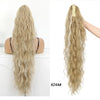 Long blonde wavy hair extension with a plastic ponytail holder