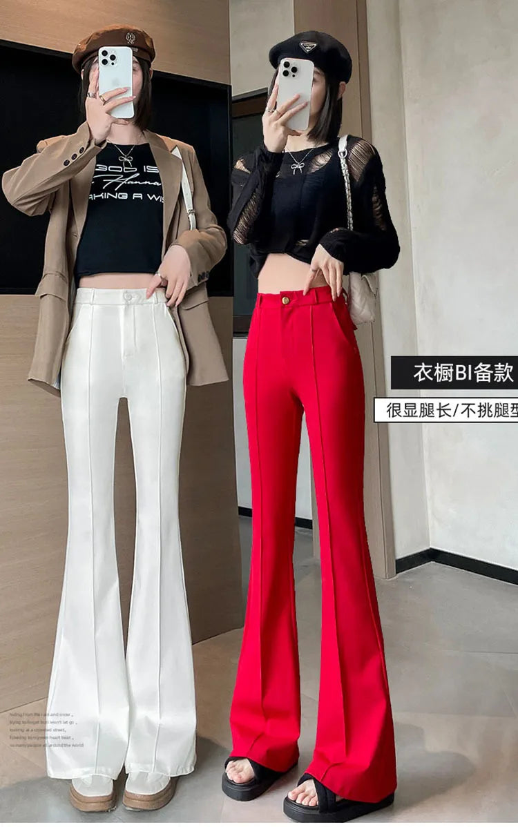 A woman models high-waist flare skinny pants in bright red and white against a light background.