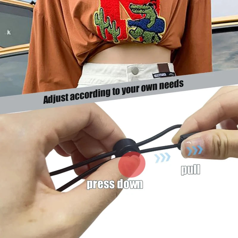 Hands demonstrate how to adjust crop tuck bands for shirts and sweaters by pulling or pressing down.