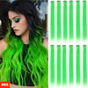 A woman models vibrant lime green hair extensions with long, wavy styling.