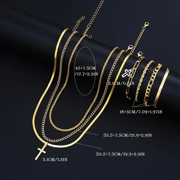 A set of elegant gold-toned stainless steel cross necklaces and chains displayed against a dark background.