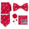 A set of red floral patterned men's tie, bow tie, and pocket square.