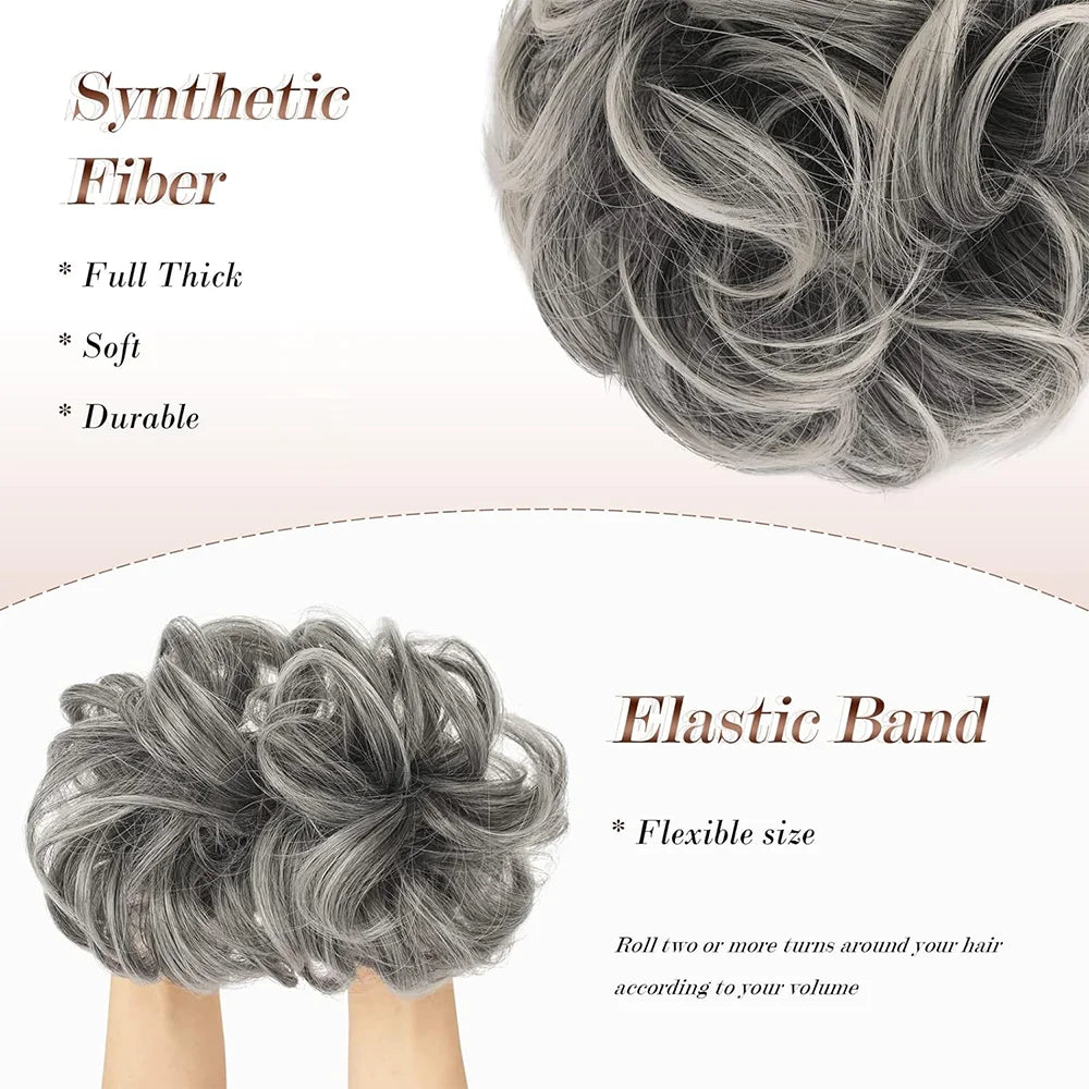 A close-up of gray synthetic fiber hair pieces and an elastic band for creating a messy bun hairstyle.