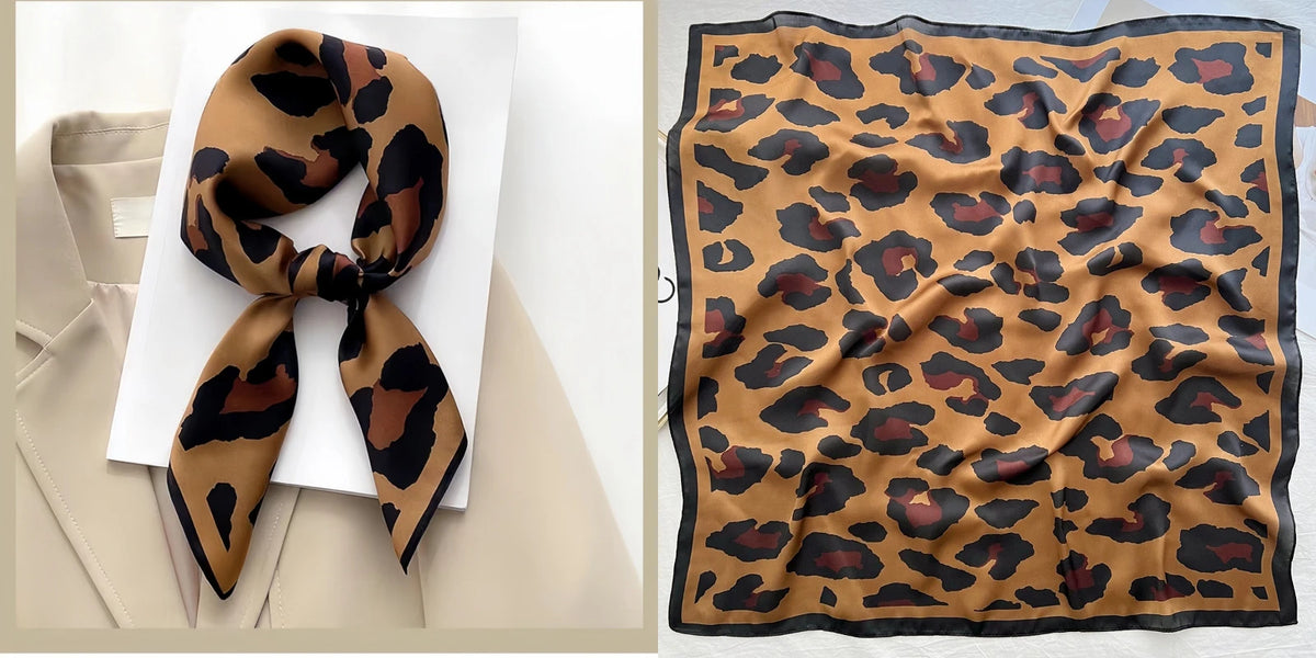 A square silk scarf featuring a brown and black leopard print on a beige background.