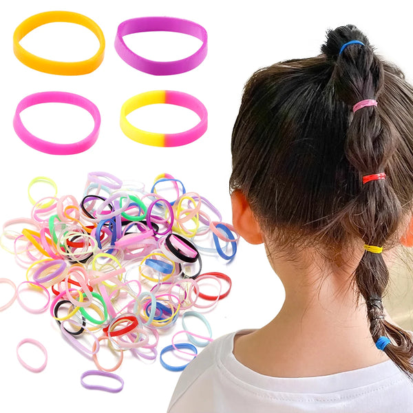 A collection of colorful elastic hair ties in various colors and styles, including rings and bands.
