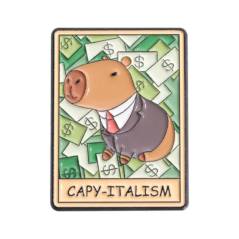 An enamel pin featuring a brown bear wearing a suit surrounded by stacks of money, labeled CAPY-ITALISM.