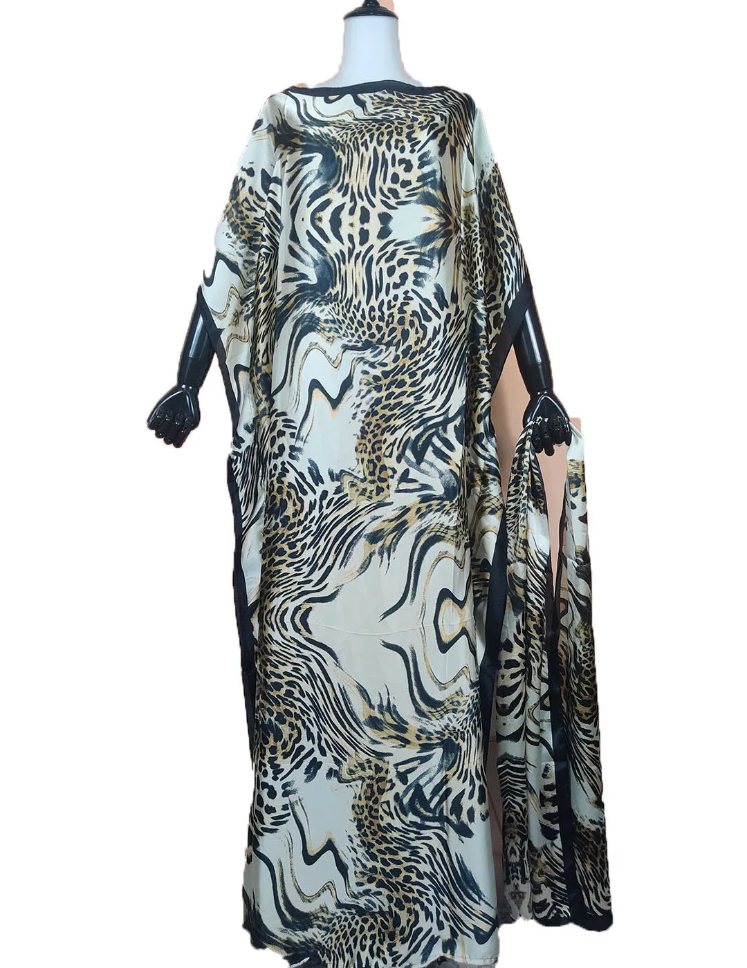 Elegant printed silk kaftan dress featuring a black and gold leopard print