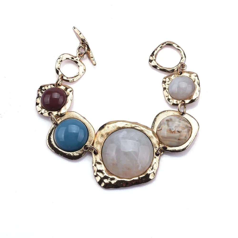 Boho gold plated resin statement choker necklace featuring round beads in shades of purple, blue, and white.