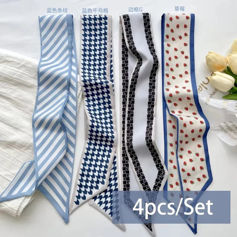 A set of four silk satin hair and bag accessories featuring blue, black, and white checkered patterns