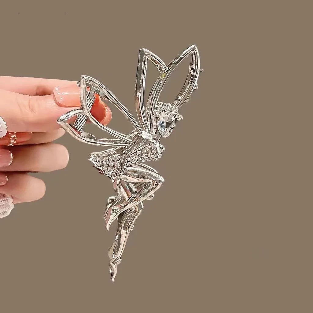 Silver rhinestone butterfly hair clip designed to look like a fairy angel