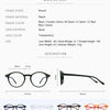 A collection of round and rectangular reading glasses in various colors including black, crystal, demi, red, brown, and green
