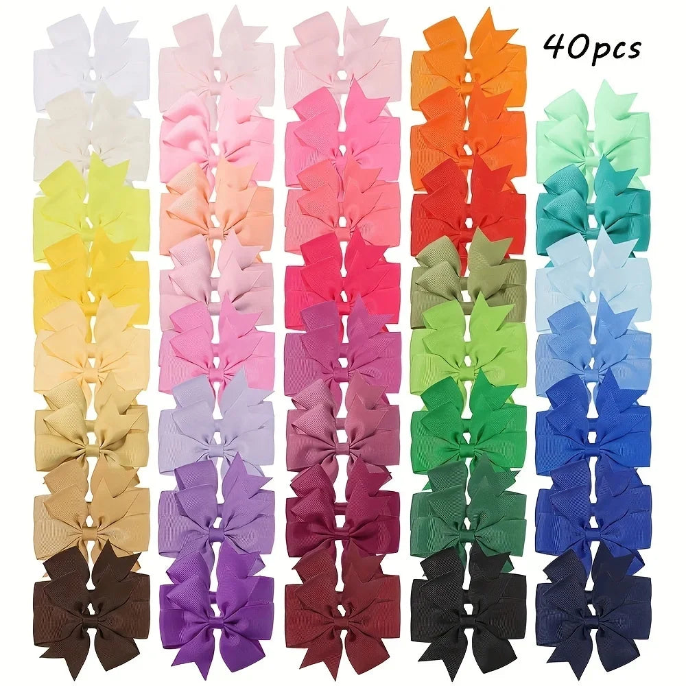 Assorted grosgrain ribbon hair bow clips in various pastel and vibrant colors for girls