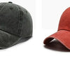 A pair of casual baseball caps, one black and one reddish-orange, shown from the side.