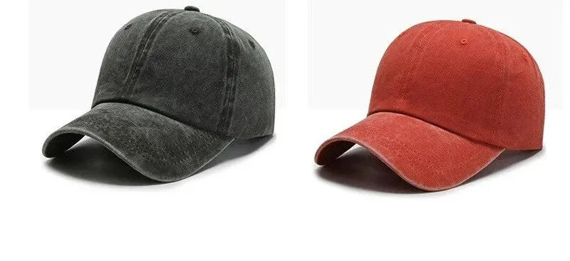 A pair of casual baseball caps, one black and one reddish-orange, shown from the side.
