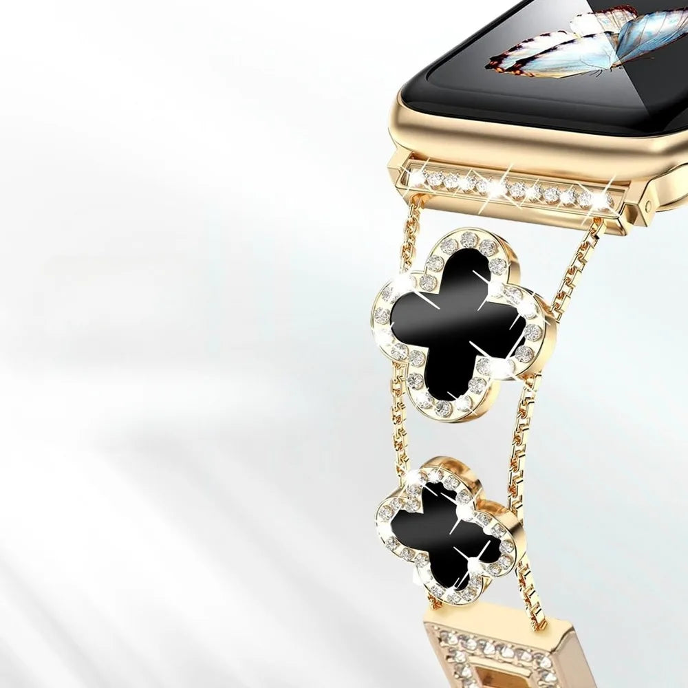 Gros plan d'un bracelet de montre universel scintillant avec des éléments métalliques dorés et des accents noirs avec des pie