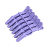 A set of six purple alligator hair sectioning clips arranged in a fan shape.