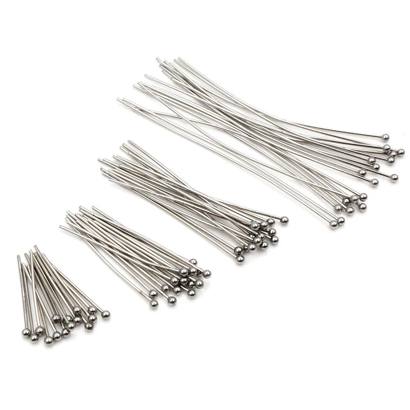 A collection of thin stainless steel ball pins used for DIY jewelry making.