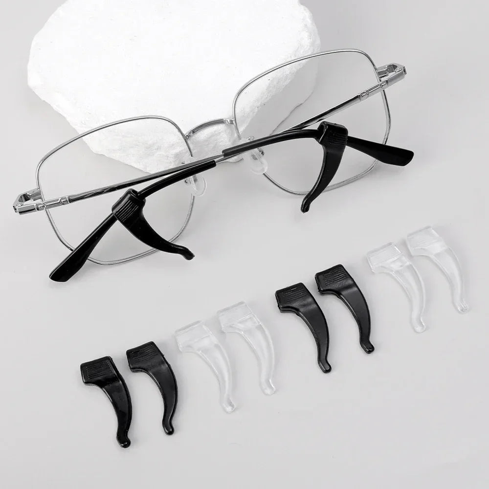 A set of black silicone anti-slip ear hooks for eyeglasses is displayed on a white background.