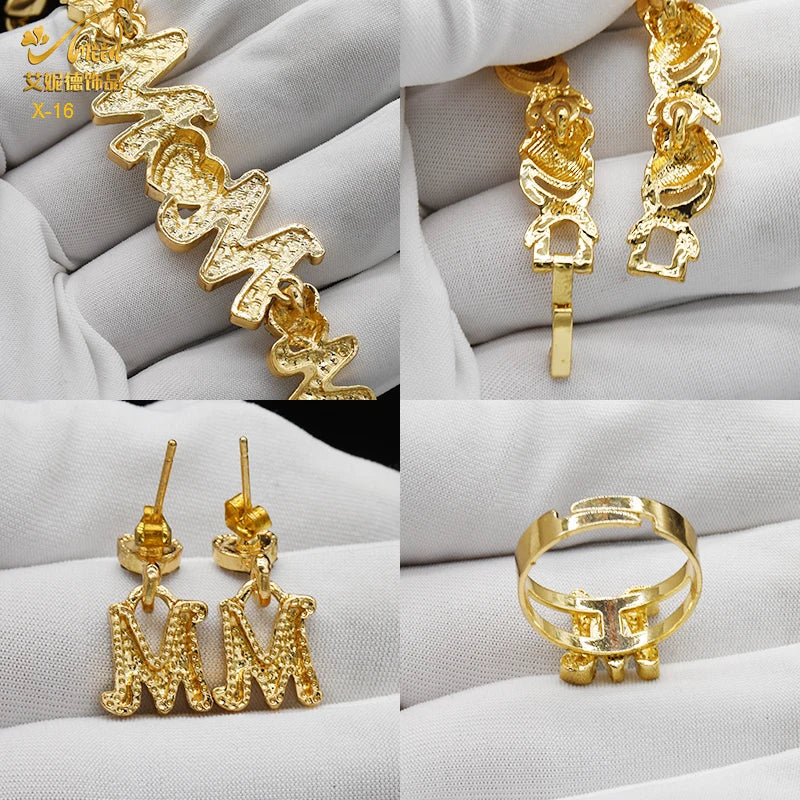 A set of 18K gold heart crystal jewelry including a necklace, earrings, and rings displayed on a white background.