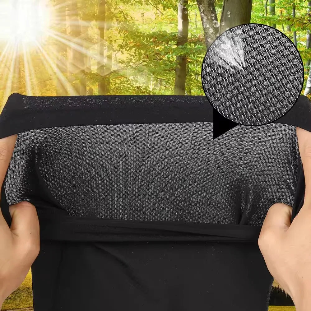 A black breathable mesh scarf is shown being held outdoors with sunlight shining through the trees.