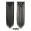 A pair of long, straight black hair extensions shown against a white background.