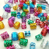 A collection of multicolor dreadlock hair rings and accessories in various shades of purple, green, pink, and gold.