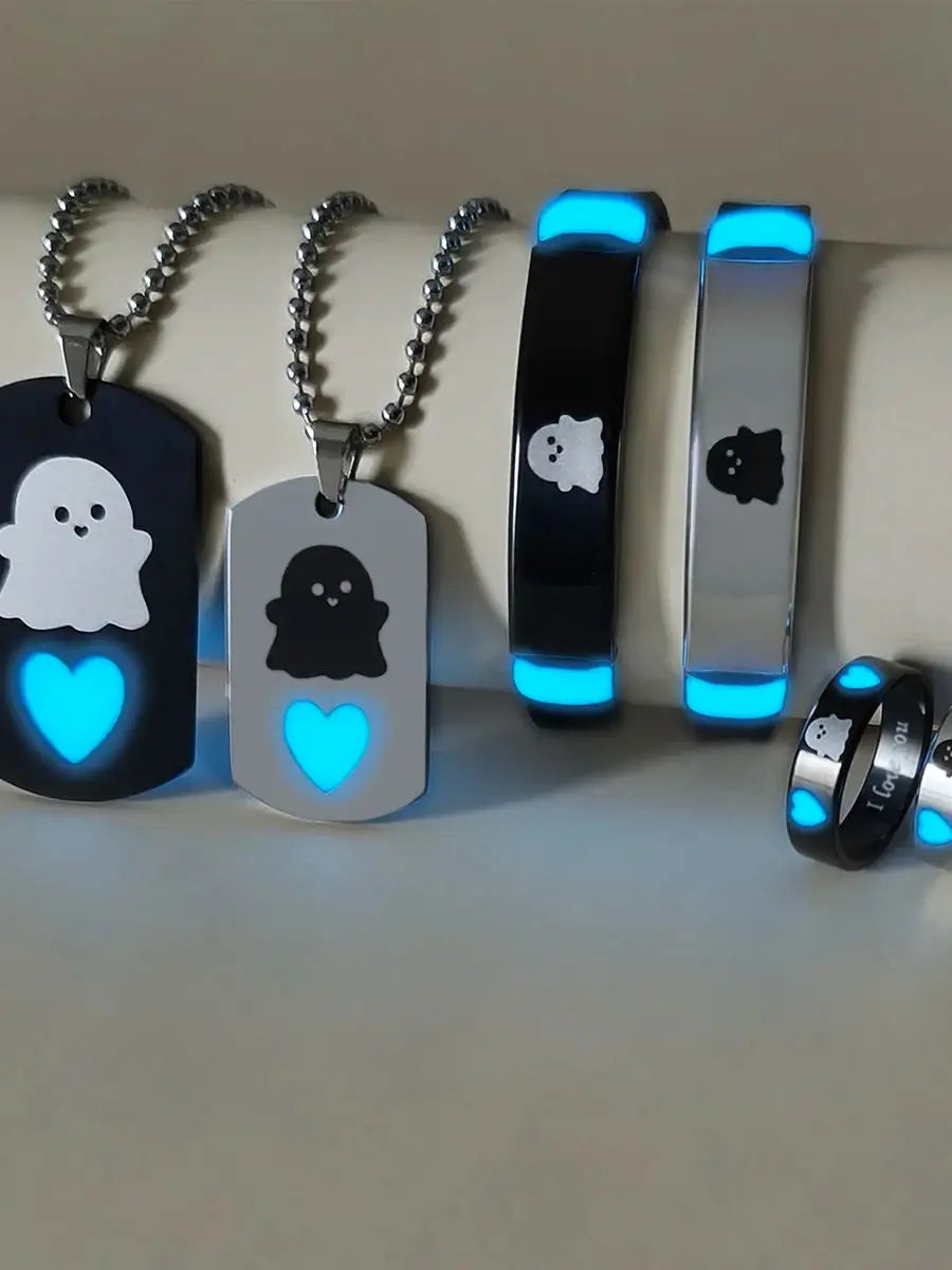A set of six luminous fairy couple jewelry pieces including pendants and bracelets.