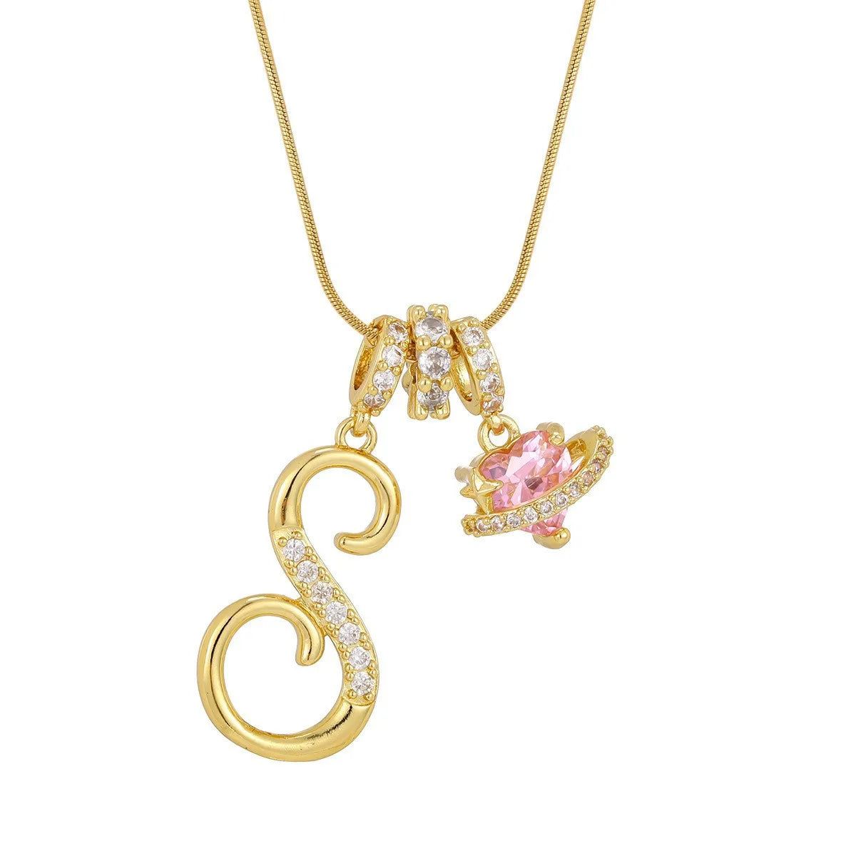 A gold letter pendant necklace featuring an initial charm and a pink gemstone.