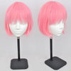 A pair of pink short hair wigs displayed on professional mannequin stands for practice and display.