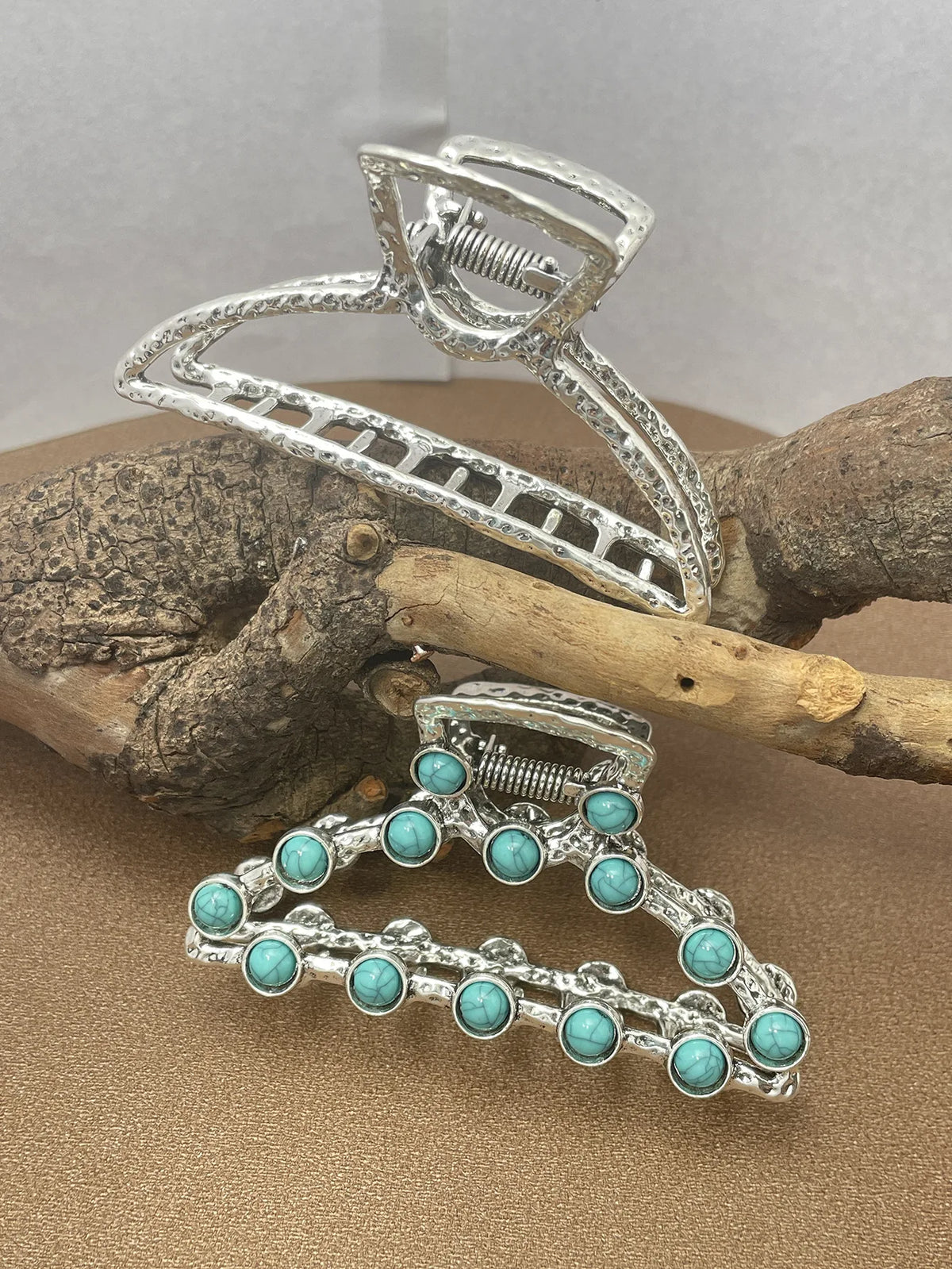 Silver metal hair claw clips decorated with turquoise beads and wire detailing