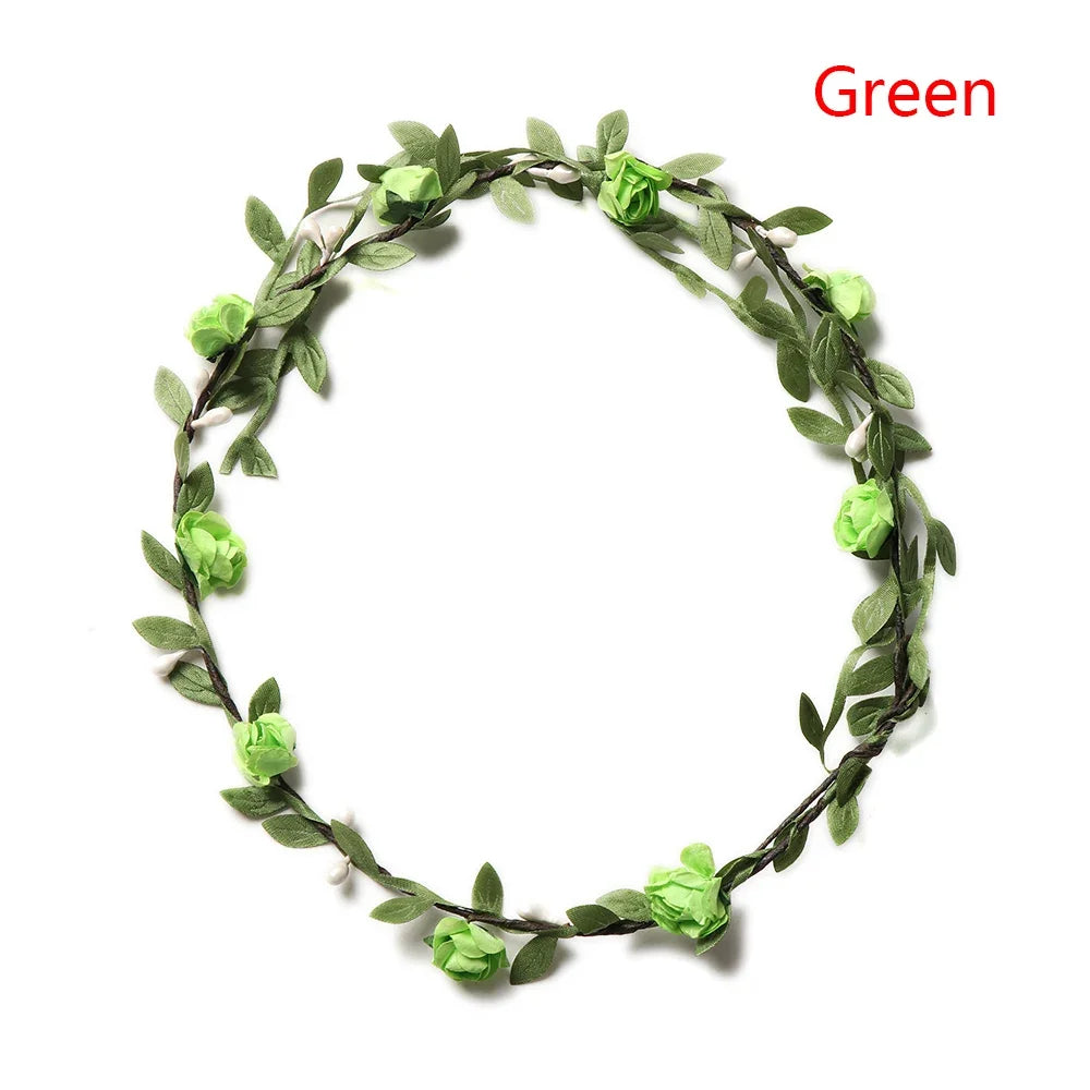 A green floral wreath or headband made of leaves and small flowers.