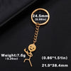 Gold-colored keychain featuring a stickman figure with a middle finger and a measurement circle.