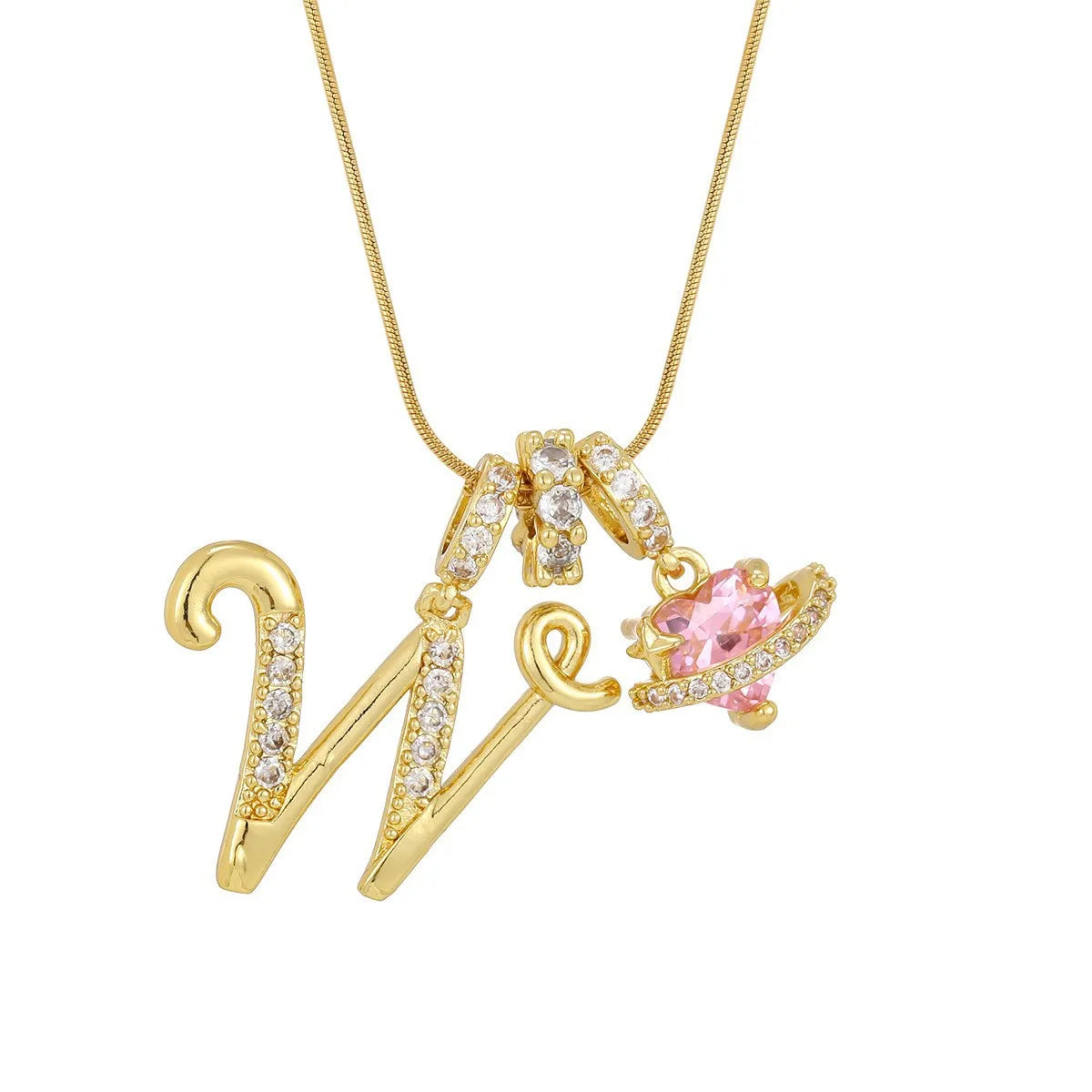 A gold letter pendant necklace shaped like the letter W with small diamonds and a pink gemstone charm