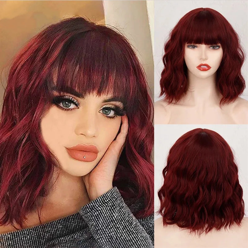 A woman models a long, curly red wine colored synthetic wig with bangs.