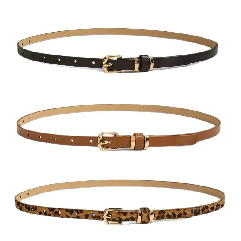 A set of three slim PU leather belts in brown, tan, and leopard print patterns with vintage buckles.