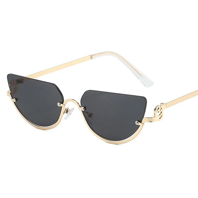 Gafas de estilo ojo de gato retro con marco de oro y lentes oscuros