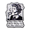 An enamel pin featuring a stylized portrait of a woman with dark hair and a black top, set against a white background.