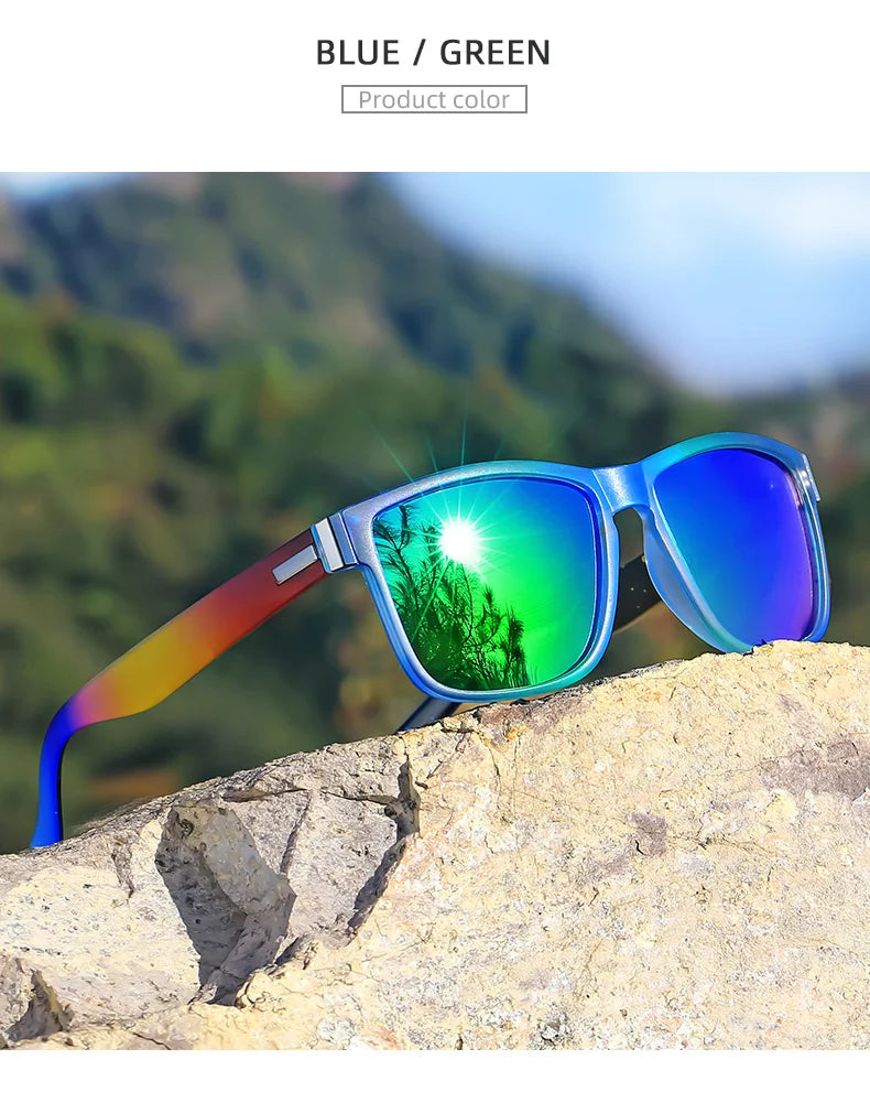 Blue and green gradient polarized sunglasses resting on a light-colored rock outdoors.