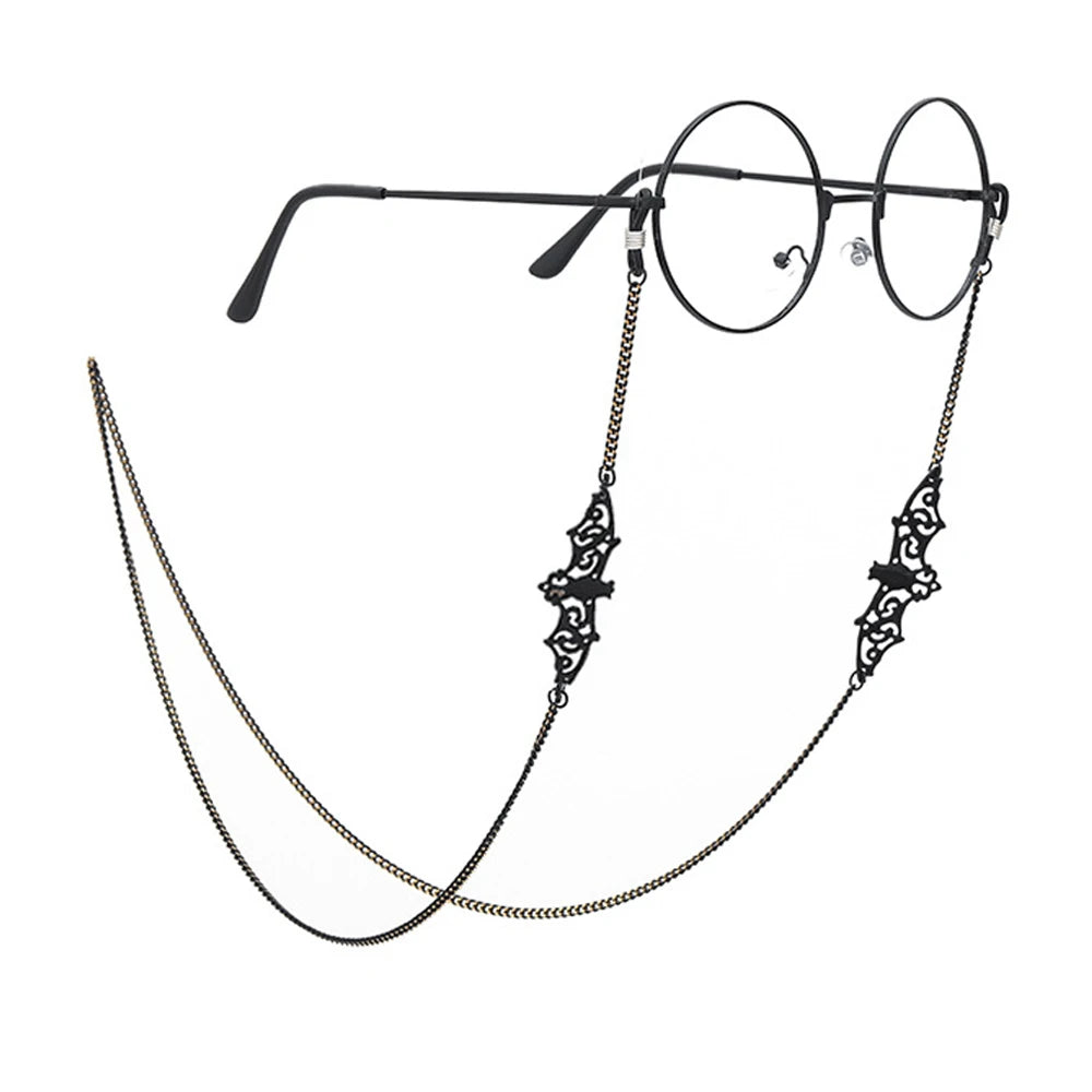 A pair of black-rimmed eyeglasses with a lanyard and chain attached.