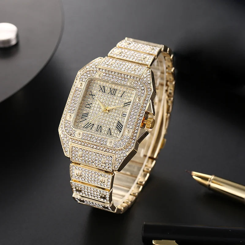 A gold-toned luxury men's quartz business watch with a diamond-encrusted bezel and bracelet on a dark background.