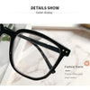 Detail display of a black fashion frame eyeglasses with a rivet inlay.