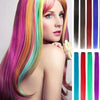 A woman models vibrant rainbow colored straight hair extensions with various shades and lengths.