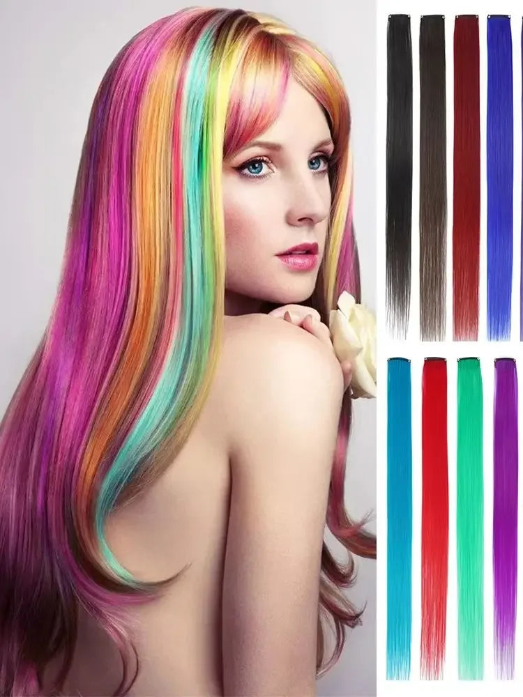 A woman models vibrant rainbow colored straight hair extensions with various shades and lengths.