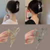 A close-up of a silver rhinestone butterfly hair clip designed to look like a fairy angel, shown in various angles.