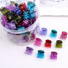 A collection of colorful adjustable hair claw clips in various shades including purple, blue, and pink, displayed in a clear 