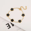 Pulsera de acero inoxidable chapada en oro con pequeños adornos de flores negras