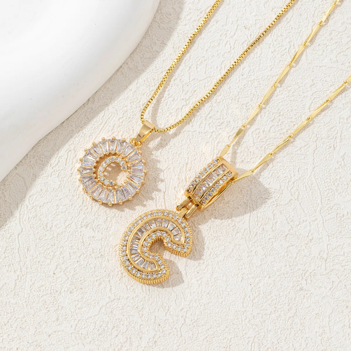 Gold-toned necklace set featuring CZ crystal pendants shaped like the letters A and Z.